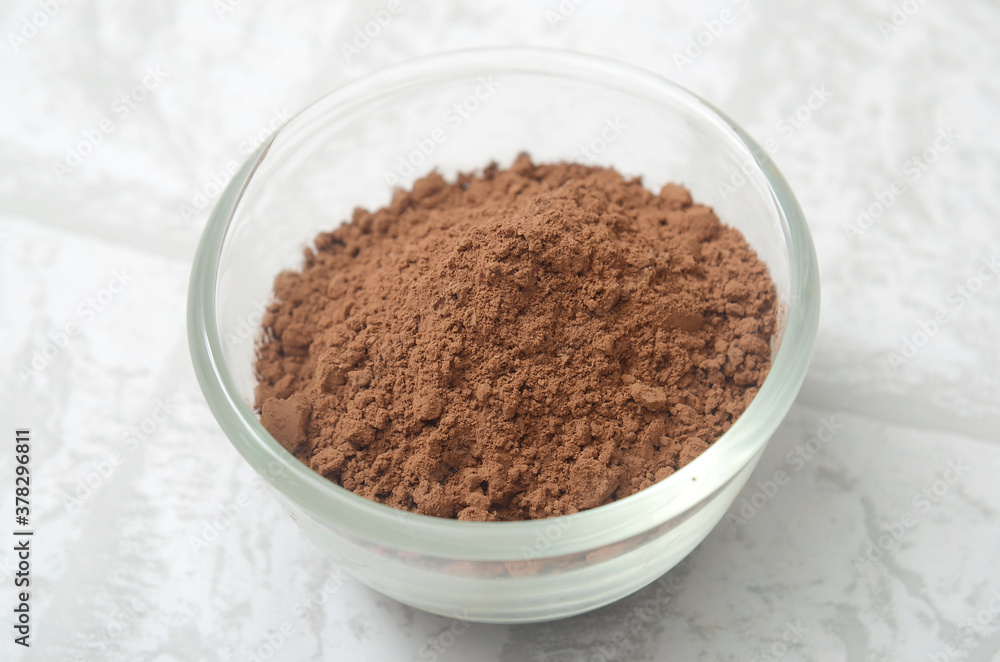 cocoa powder in a glass bowl cocoa powder in a glass bowl