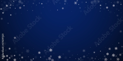 Sparse snowfall Christmas background. Subtle flyin