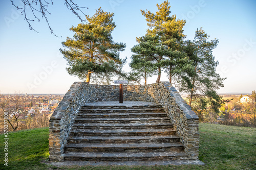 Pichora Marcomanni burial ground south of Dobrichov in the Kolin region Czech republic. Archaeological excavations With small lookout tower with wiew to small city Dobrichov. Educational trail. photo