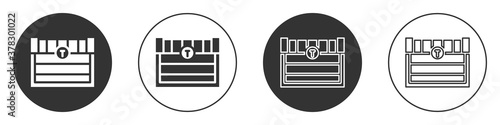 Black Antique treasure chest icon isolated on white background. Vintage wooden chest with golden coin. Circle button. Vector.