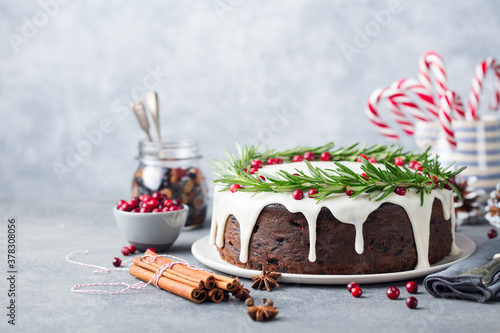 Christmas fruit cake, pudding on white plate. Copy space. photo