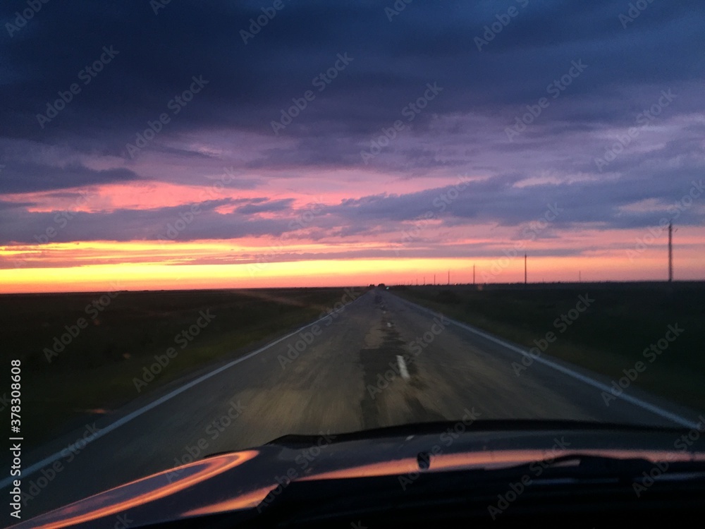 driving on the highway at sunset