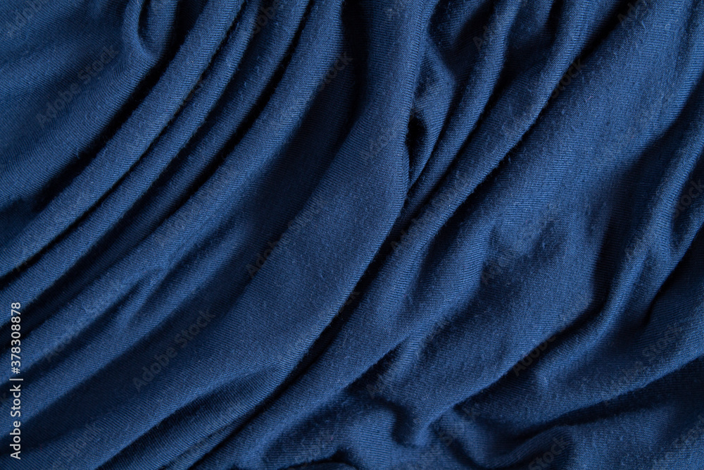 Fototapeta premium Texture of crumpled blue satin fabric.