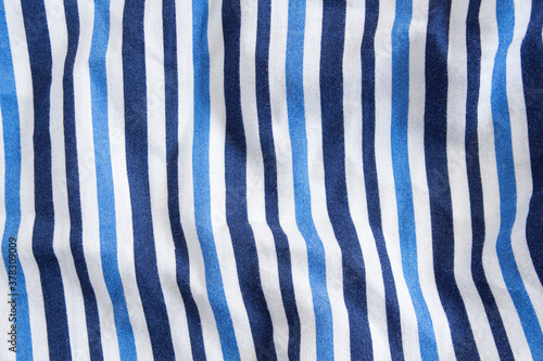 Crumpled cotton fabric with blue stripes