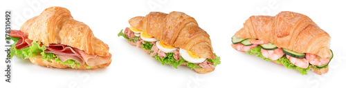 collection of croissant with parma ham, tuna, eggs, boiled shrimps and lettuce isolated on white