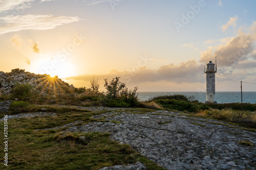 Subbe lighthouse during sunset in southern Varberg, Sweden. Selective focus.