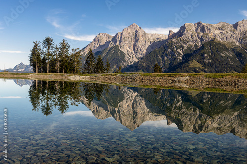 Reflection of mountains in Prinzensee lake at Natrun Austria