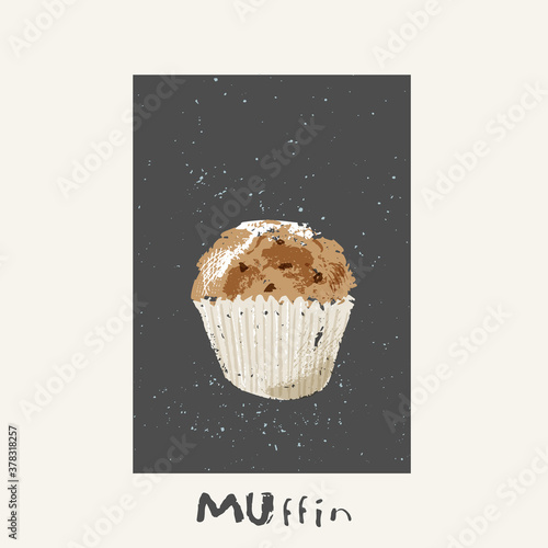 Sweet muffin with chokolat chips and sugar icing on blackboard photo