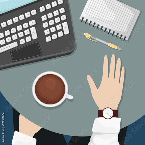 A man is sitting at a table in a cafe with a computer and a Cup of coffee. Freelance. Business meeting. Conversation.
