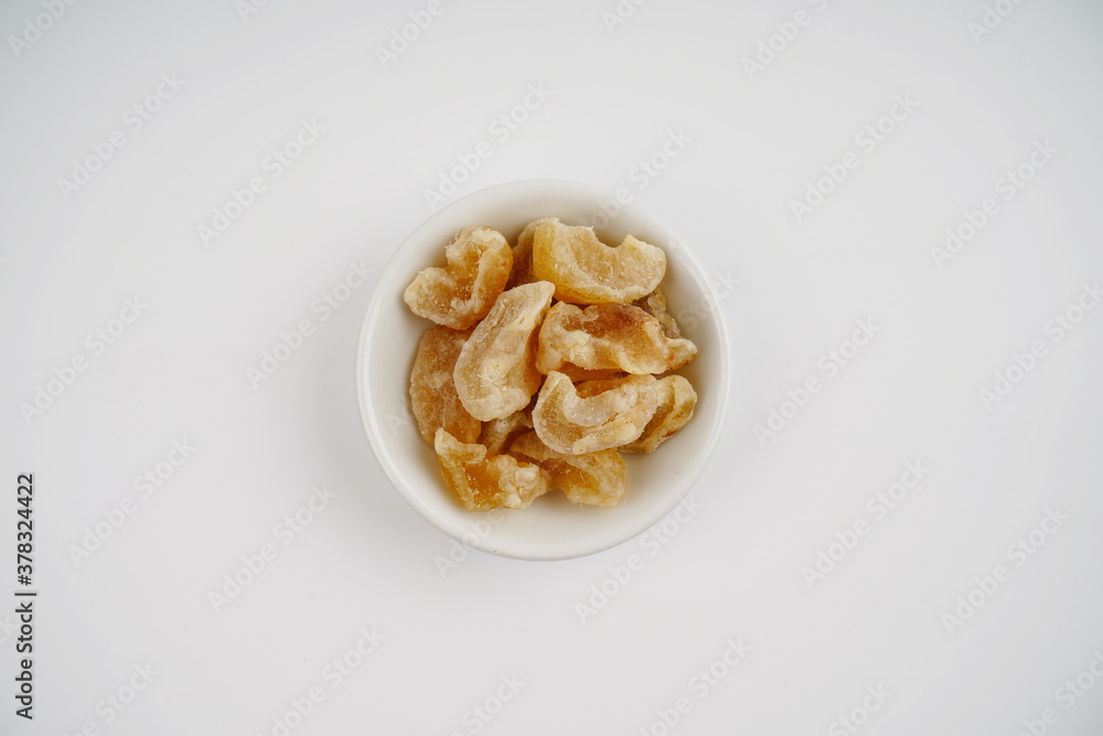 gooseberry candy in White bowl over white background gooseberry candy in White bowl over white background