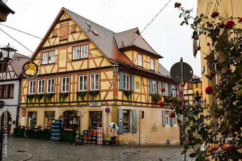 Traditional half-timbered houses on narrow medieval street in Rothenburg ob der Tauber, Bavaria, Germany. November 2014