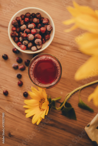 Fototapeta Naklejka Na Ścianę i Meble -  Still life. Berries and juice on a wooden table.