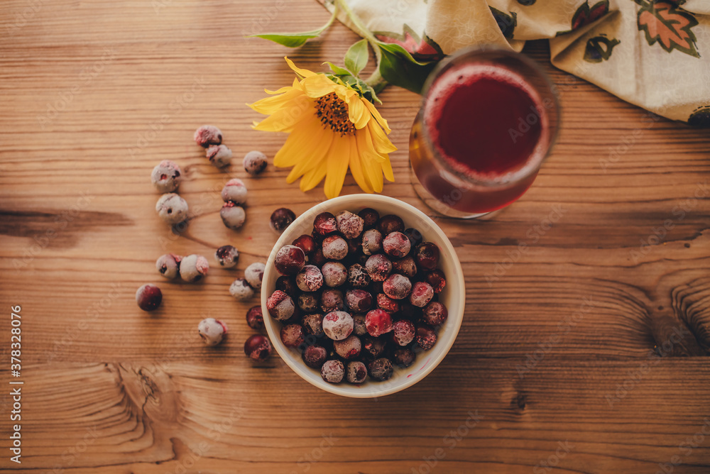 Still life. Frozen cherries and cherry juice on wooden background Still life. Frozen cherries and cherry juice on wooden background