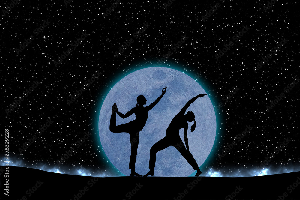 Fototapeta premium two women silhouette in yoga position against a black starry sky with copy space for your text