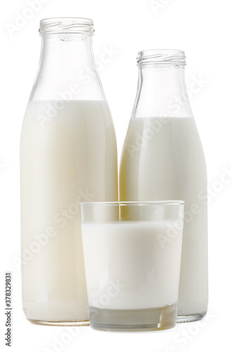 Glass cup and bottle of fresh milk isolated