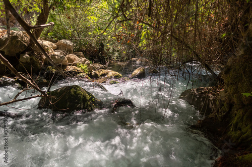 The bed of the swift mountainous Hermon River with crystal clear waters in the Golan Heights in northern Israel