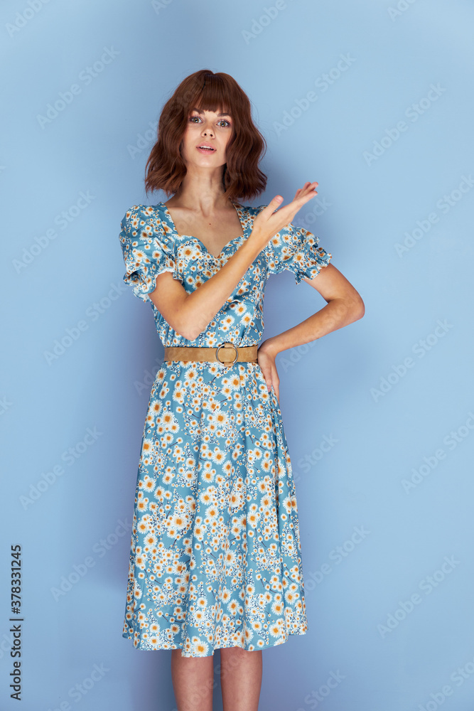 Woman in flower dress gesture with hands look ahead Copy Space attractive look Woman in flower dress gesture with hands look ahead Copy Space attractive look