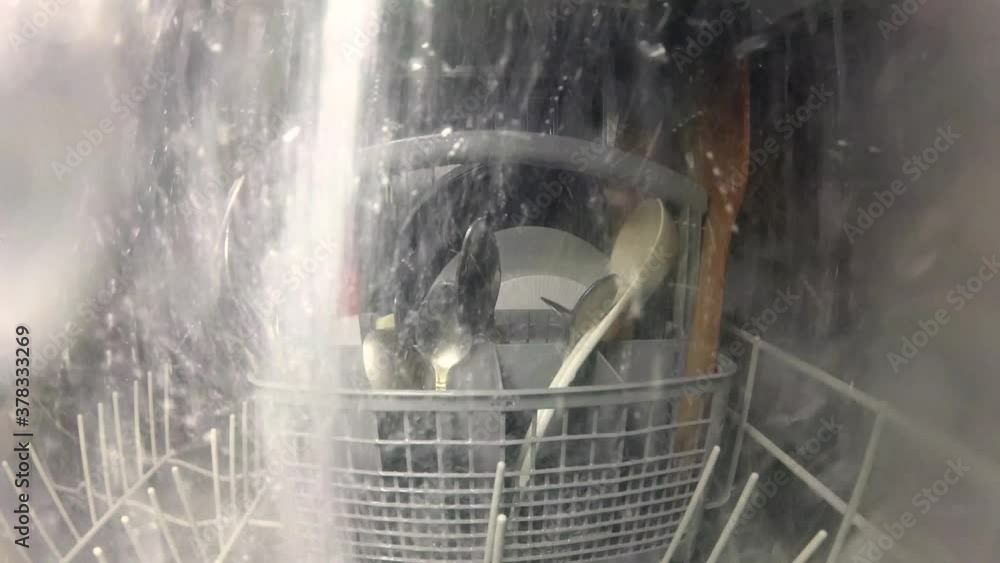 Video Stock Inside the dishwasher. The process of washing dishes. Water