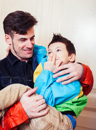 faher and son together having fun at home, lifestyle happy family, people at home photo