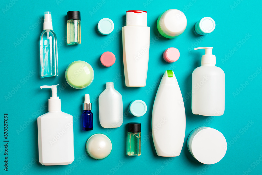 Group of plastic bodycare bottle Flat lay composition with cosmetic products on colored background empty space for you design. Set of White Cosmetic containers, top view with copy space Group of plastic bodycare bottle Flat lay composition with cosmetic products on colored background empty space for you design. Set of White Cosmetic containers, top view with copy space
