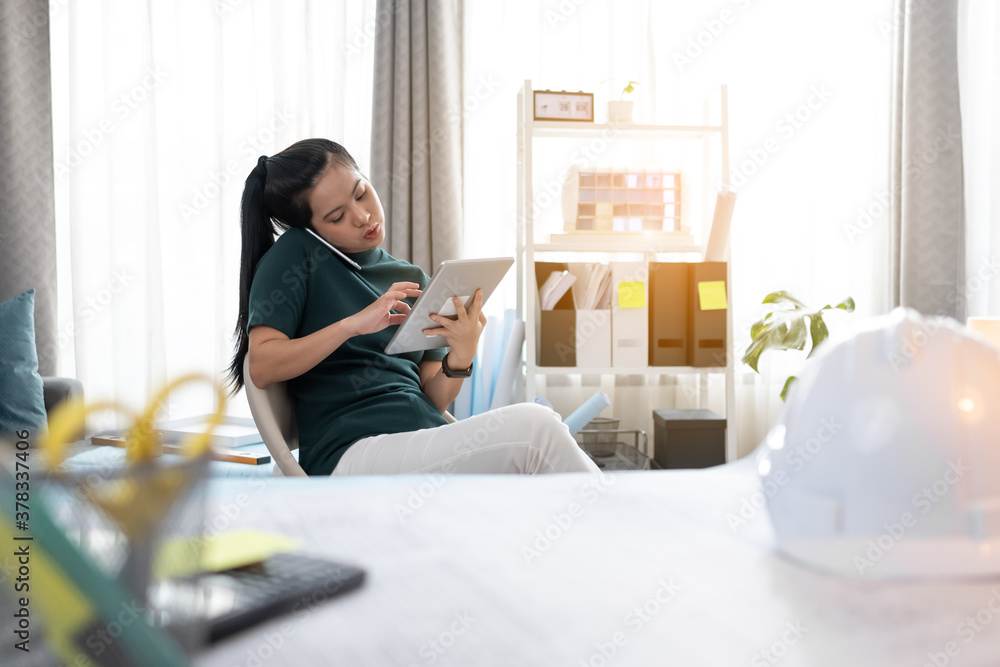Architect or Engineer woman is working seriously at home. Architect or Engineer woman is working seriously at home.