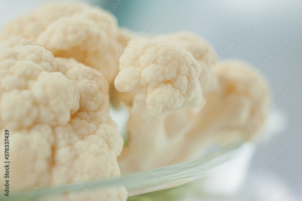 Cauliflower on a light background. Vegetables close-up. Macro photo. Cauliflower on a light background. Vegetables close-up. Macro photo.