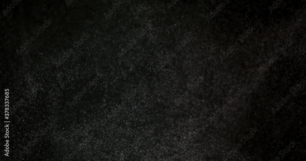 White dust powder isolated on black background White dust powder isolated on black background