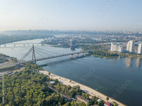 North bridge over the Dnieper river in Kiev. Aerial drone view.