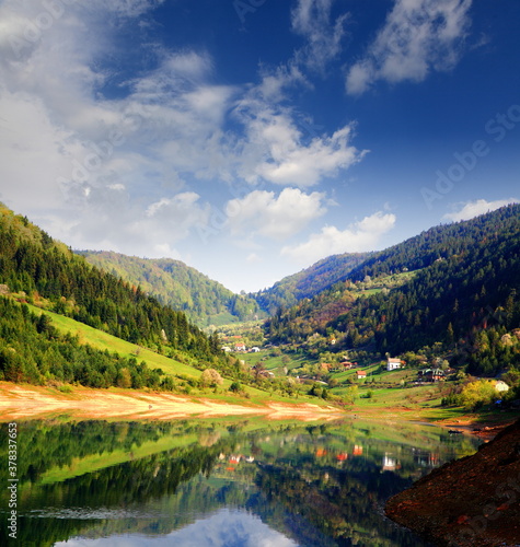 Landscape view on mountains, hills ,lake and meadow in village in Tara national park in Serbia