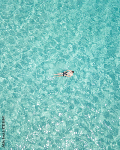 Man chilling in a crystal clear water / Ibiza