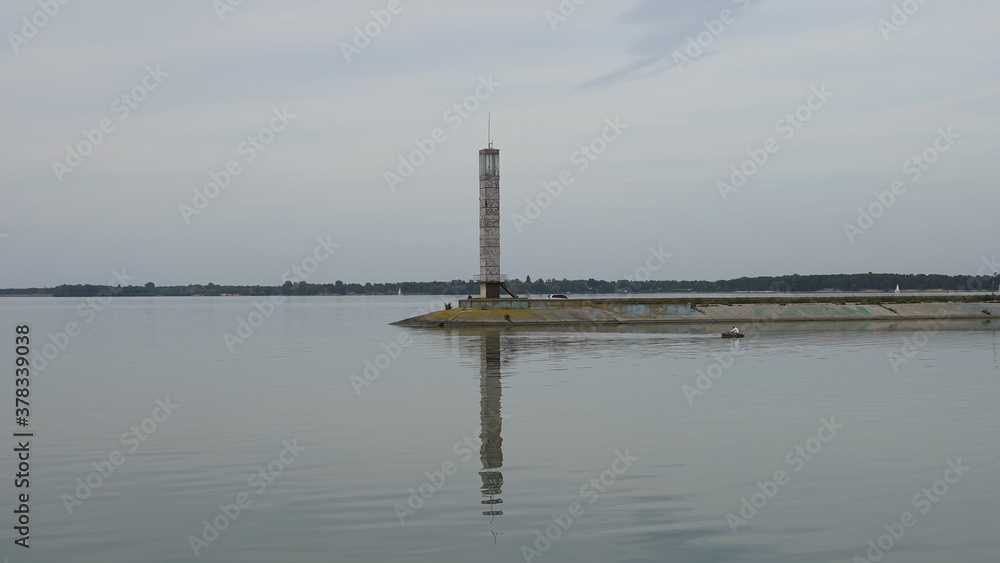 Vyshgorod, Kiev region, Ukraine - September 2020: A pleasure motor ship passes the locks of the Kiev reservoir. The motor ship passes the gateway of the Kiev sea.