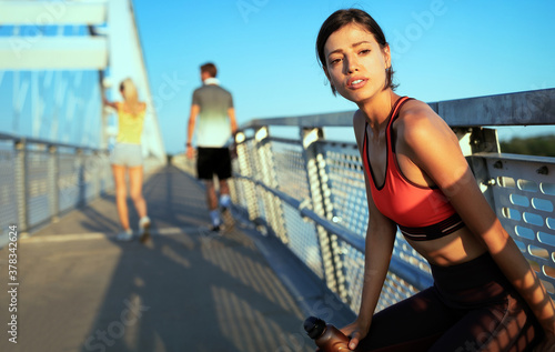 Happy young woman exercising outdoors. Living healthy life