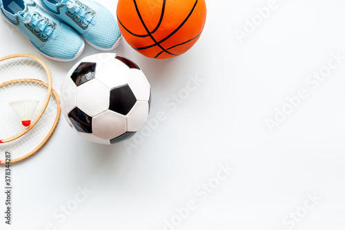 Sport games background - basketball  soccer ball  rackets  sneakers. Copy space