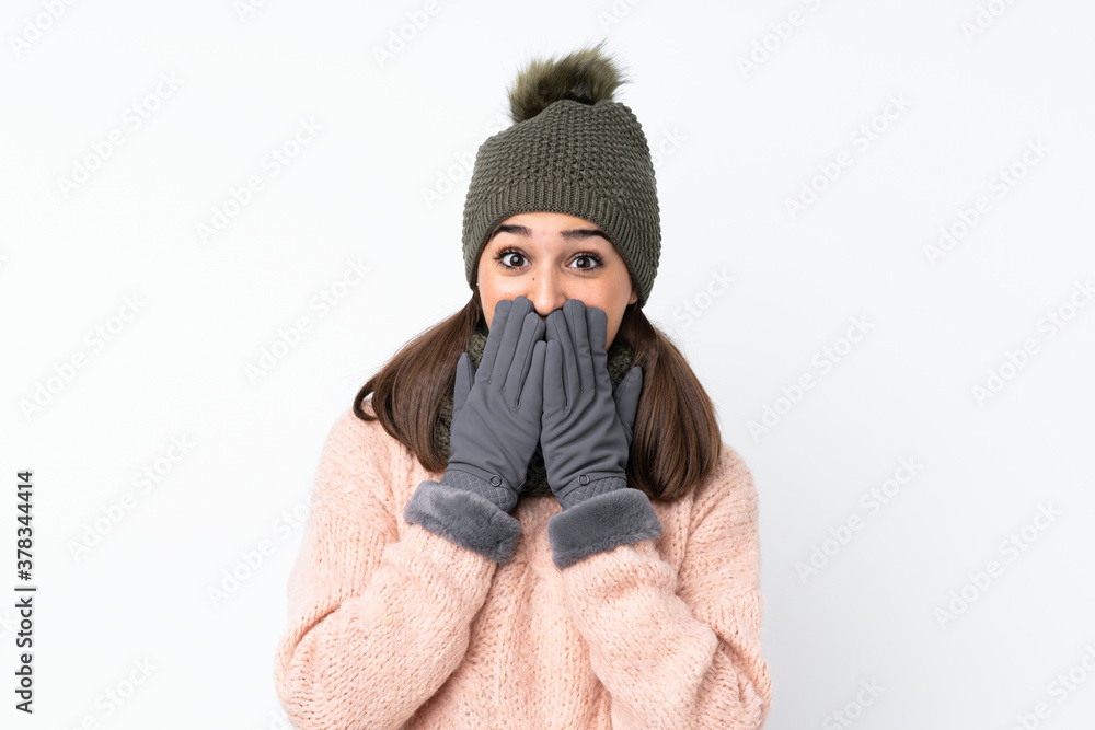 Young girl with winter hat over isolated white background with surprise facial expression Young girl with winter hat over isolated white background with surprise facial expression