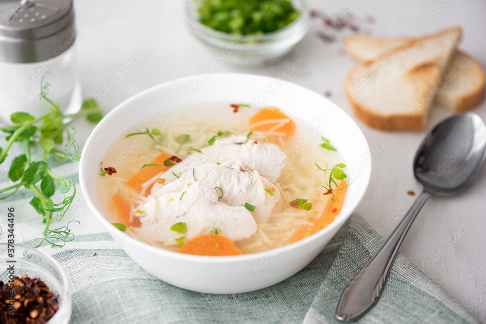chicken soup with noodles and herbs