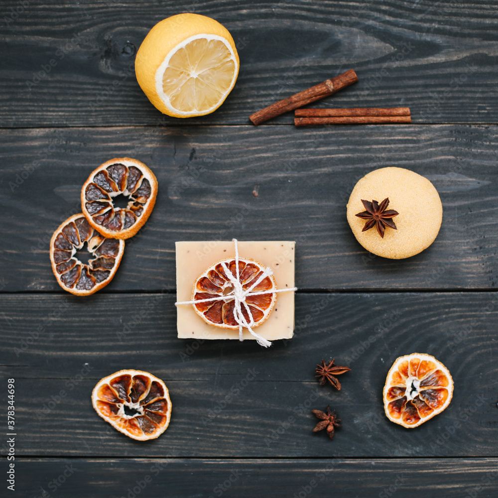 Natural citrus soap on dark background. Concept of Spa, Salon or Home body and skin care. Flat lay. Space for text, top view Natural citrus soap on dark background. Concept of Spa, Salon or Home body and skin care. Flat lay. Space for text, top view