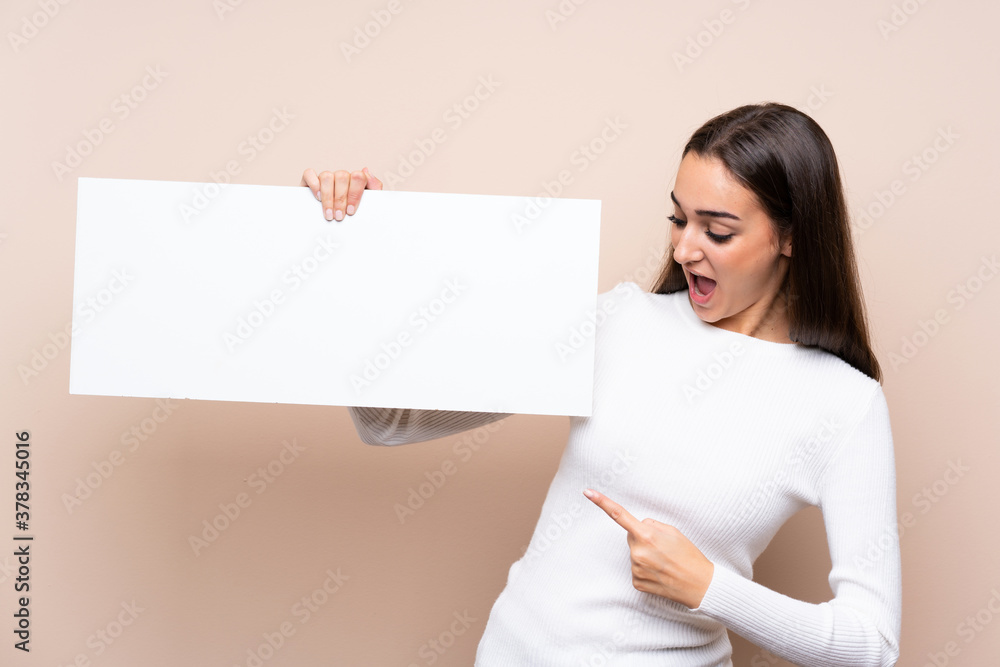 Young woman over isolated background holding an empty white placard for insert a concept Young woman over isolated background holding an empty white placard for insert a concept