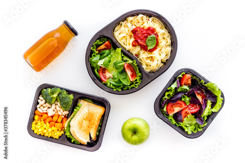 Delivery containers with takeout food on table. View from above