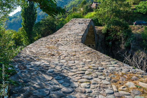 The stone arch bridge over the Ajaristskali river, Dandalo bridge, Georgia photo