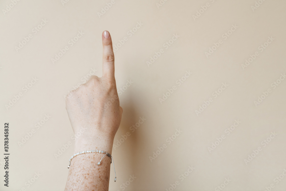 Woman's hand pointing away isolated Woman's hand pointing away isolated
