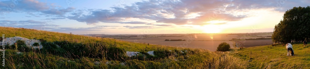 landscape at sunset at avesbury hill england