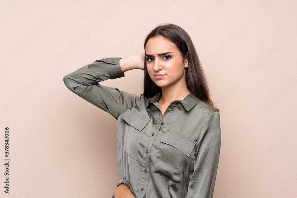 Young girl over isolated background having doubts Young girl over isolated background having doubts
