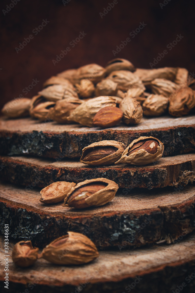 Nuts on a wooden background. Harvesting almonds. Vintage toning.