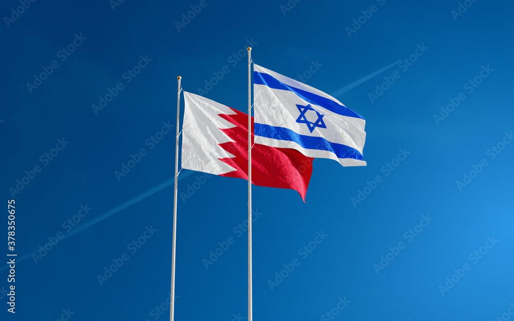 Bahrain and Israel Flags waving against a blue sky background. Bahrain–Israel signing historic diplomatic deal. Jerusalem and Manama relations 2020.