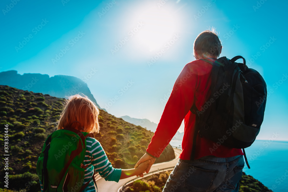 father and daughter travel in nature, family hiking in mountains