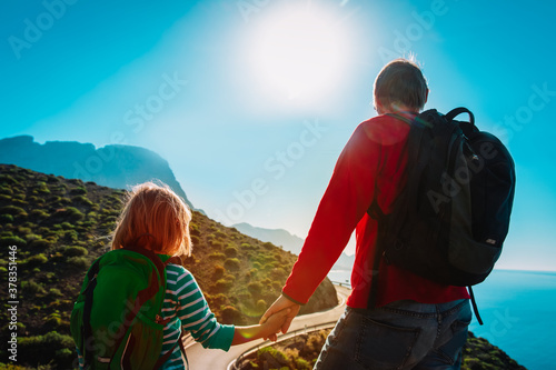 father and daughter travel in nature, family hiking in mountains