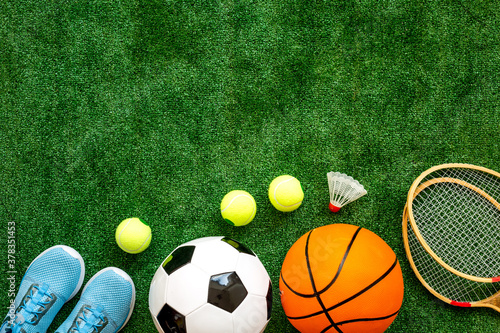 Sport games background - basketball, soccer ball, rackets, sneakers - copy space