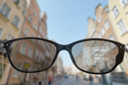 Fototapeta Naklejka Na Ścianę i Meble -  Running in the city with smart glasses
