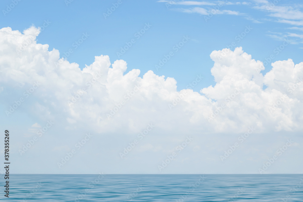 Beautiful sky with clouds over blue sea water, big cloud above ocean Beautiful sky with clouds over blue sea water, big cloud above ocean