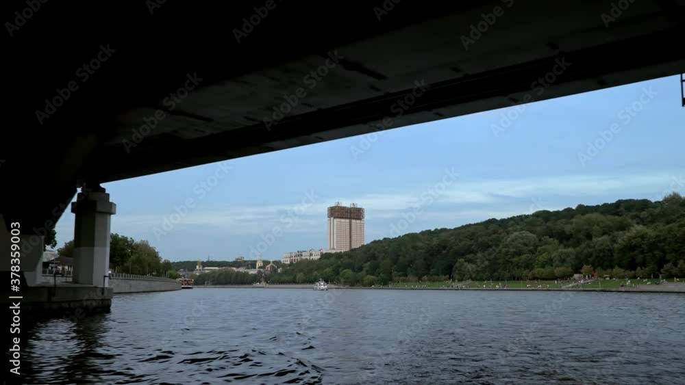 Views from a pleasure boat to the sights of Moscow, the bridge over the Moscow river with a metro station Views from a pleasure boat to the sights of Moscow, the bridge over the Moscow river with a metro station